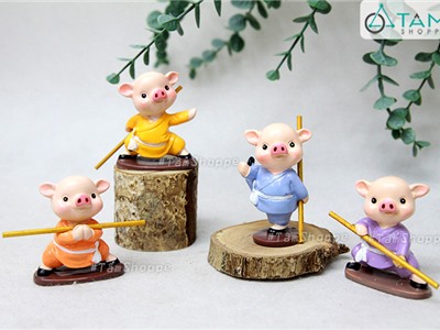 Bộ 04 tượng chú heo múa gậy